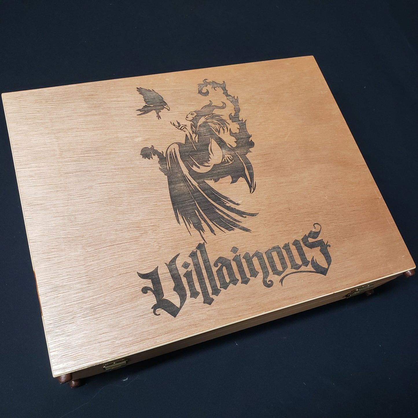 Image shows the top of the custom wood box for a Disney Villainous card game collection