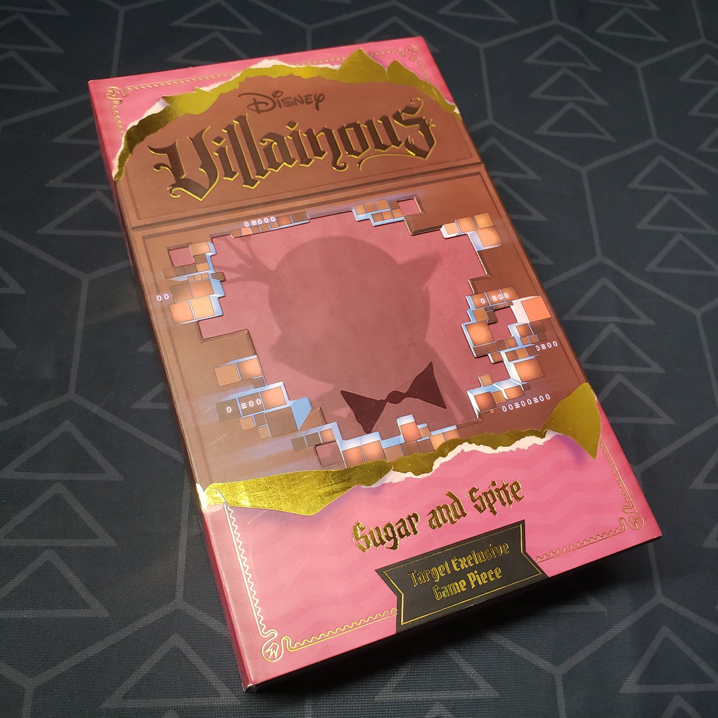 Image shows the front cover of the box for the Disney Villainous: Sugar and Spite card game
