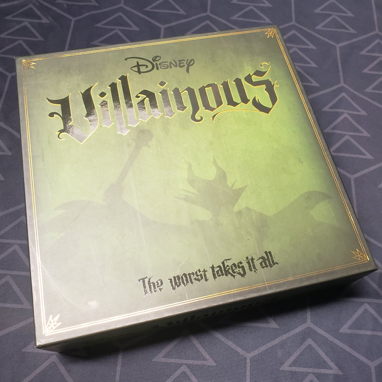Image shows the front cover of the box of the Disney Villainous board game