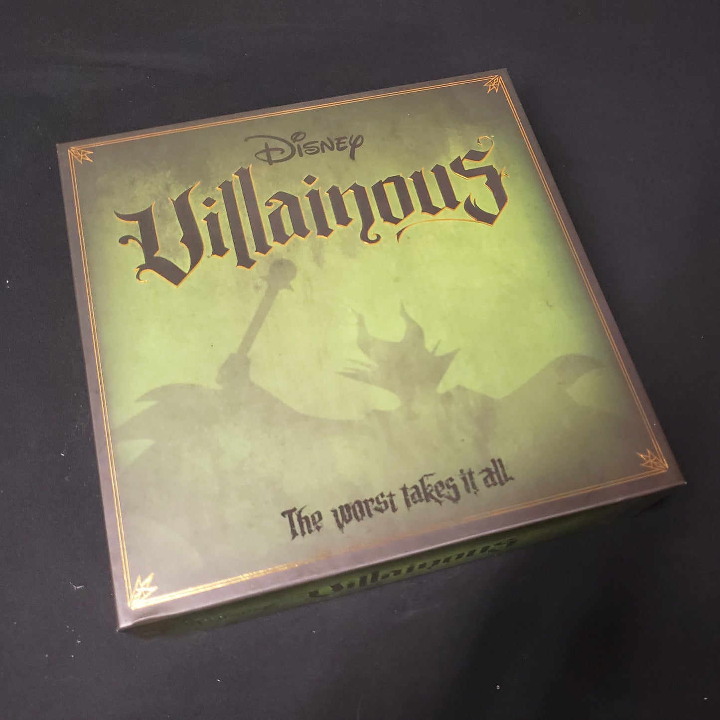 Image shows the front cover of the box of the Disney Villainous board game