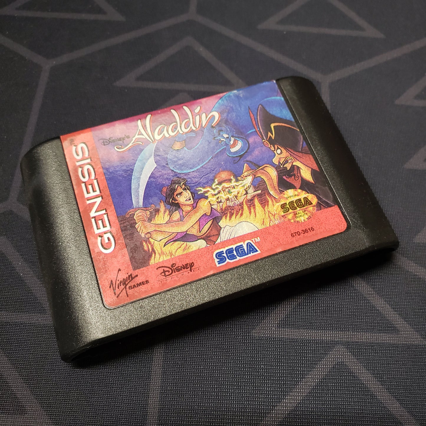 Image shows the front of the cartridge for the video game Disney's Aladdin for Sega Genesis