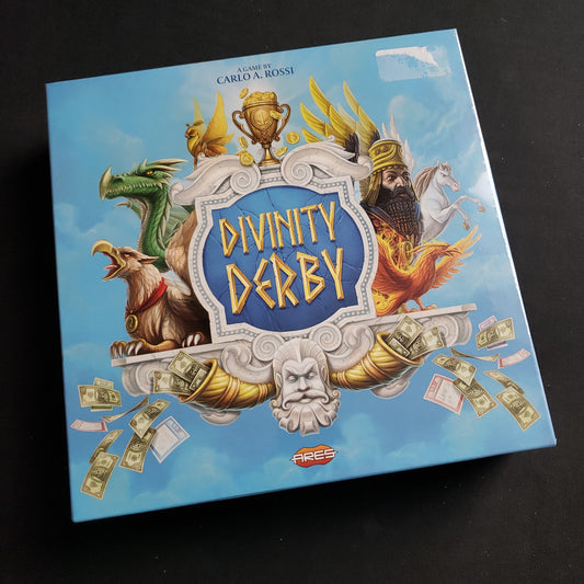 Image shows the front cover of the box of the Divinity Derby board game
