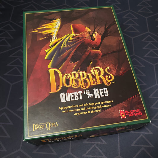 Image shows the front cover of the box of the Dobbers: Quest for the Key board game