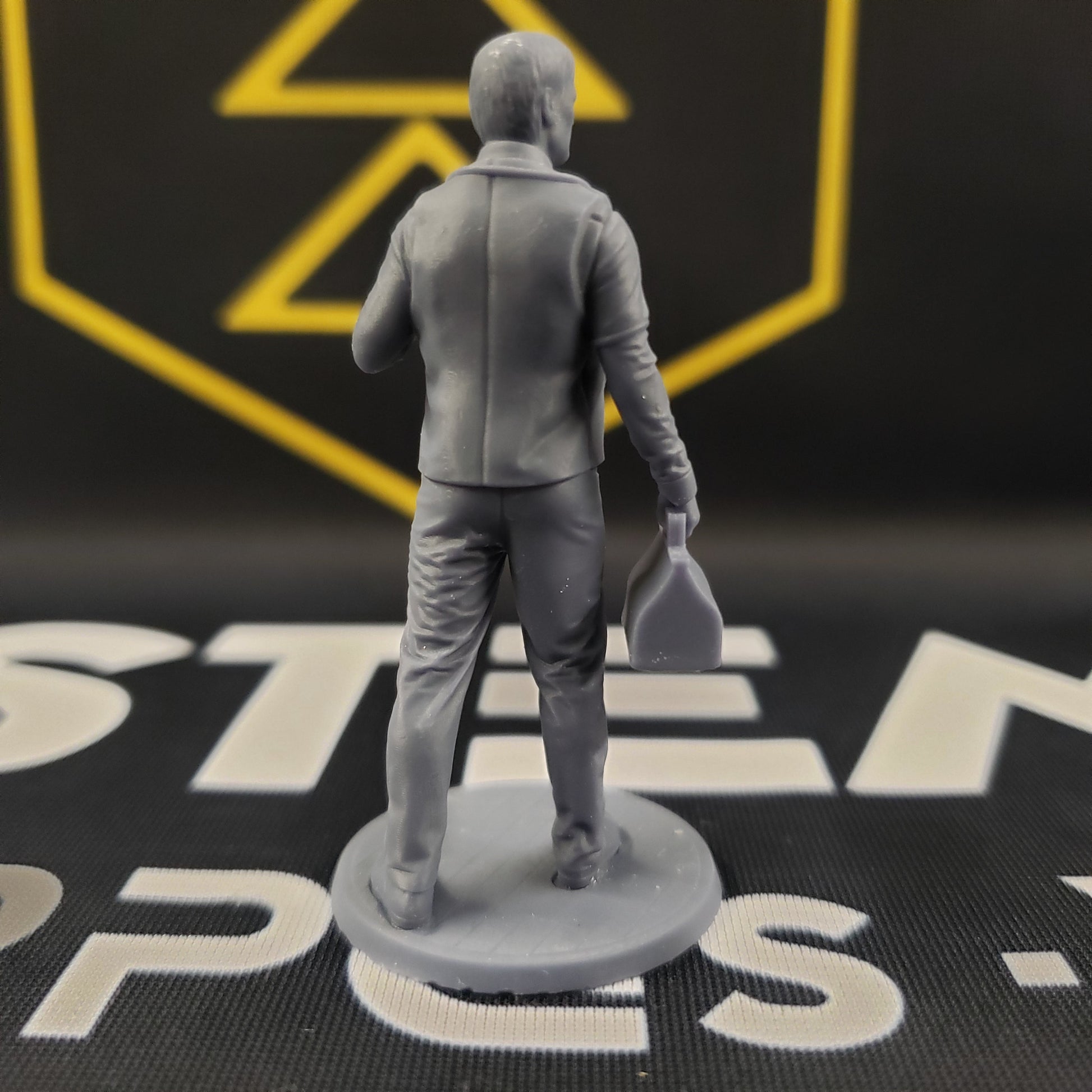 Image shows the back of a 1920s era doctor 3D printed gaming miniature
