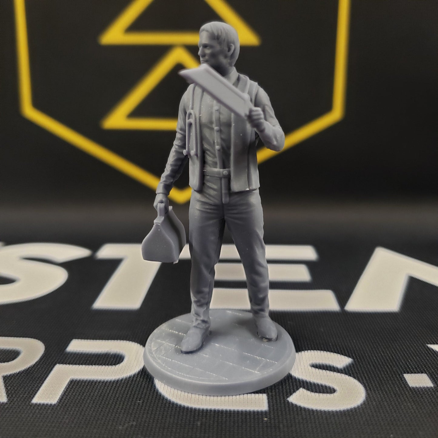 Image shows a 1920s era doctor 3D printed gaming miniature holding a bonesaw