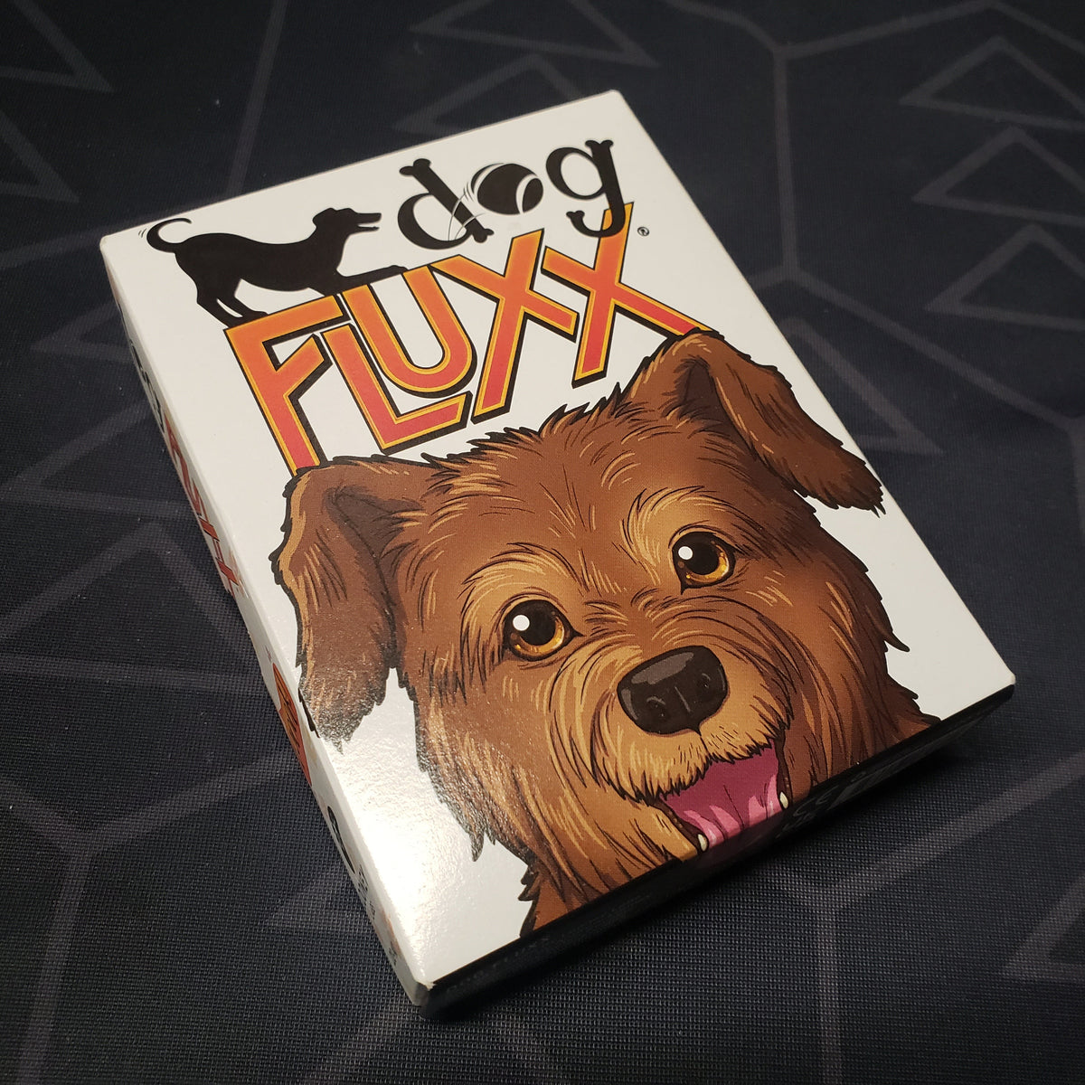 Image shows the front cover of the box for the Dog Fluxx card game