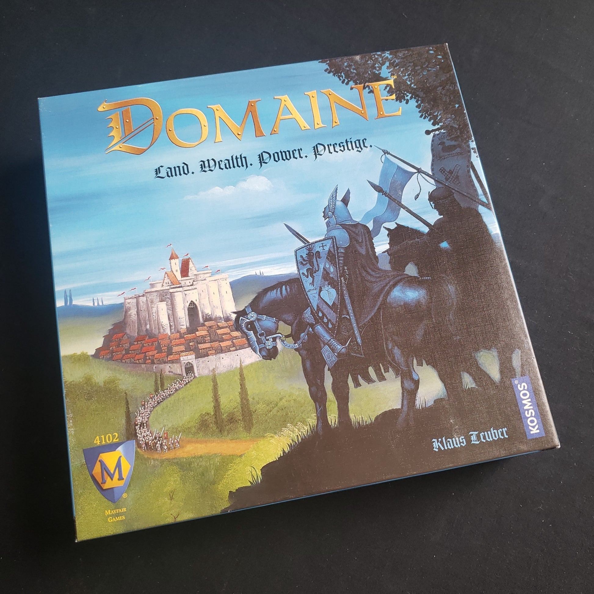 Image shows the front cover of the box of the Domaine board game