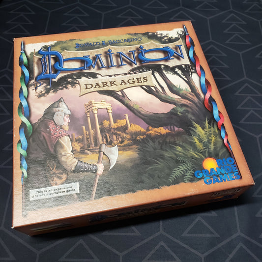 Image shows the front cover of the box for the Dominion: Dark Ages card game expansion