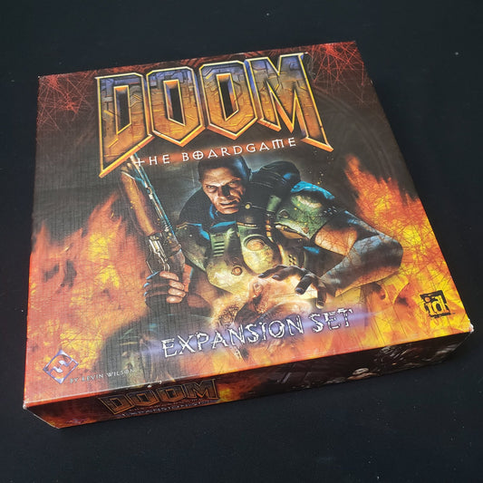 Image shows the front cover of the box of the Expansion Set for Doom: The Board Game