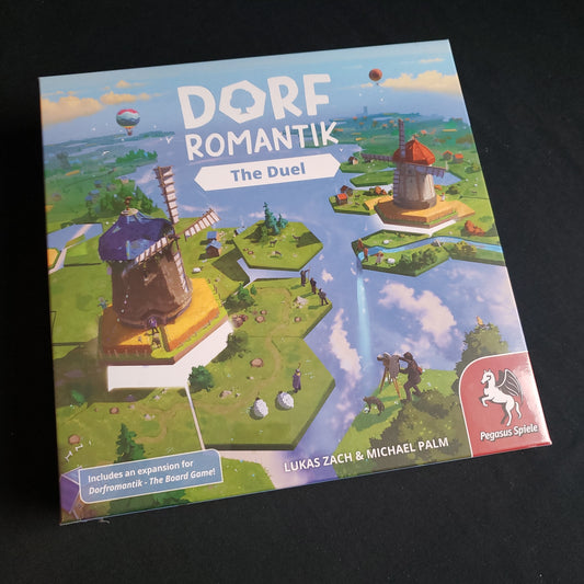 Image shows the front cover of the box of the board game Dorfromantik: The Duel