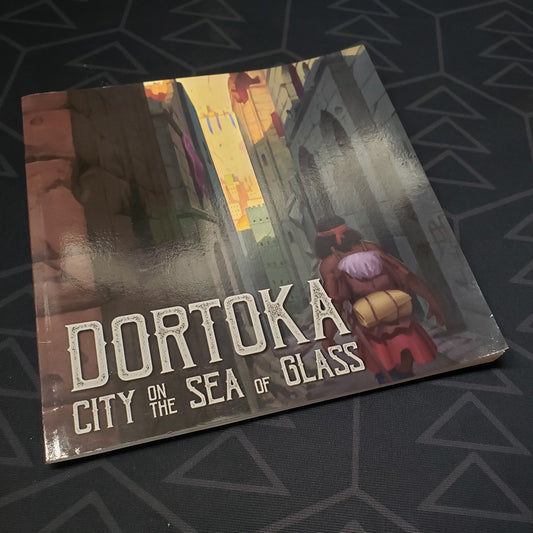 Image shows the front cover of the Dortoka: City on the Sea of Glass roleplaying game book