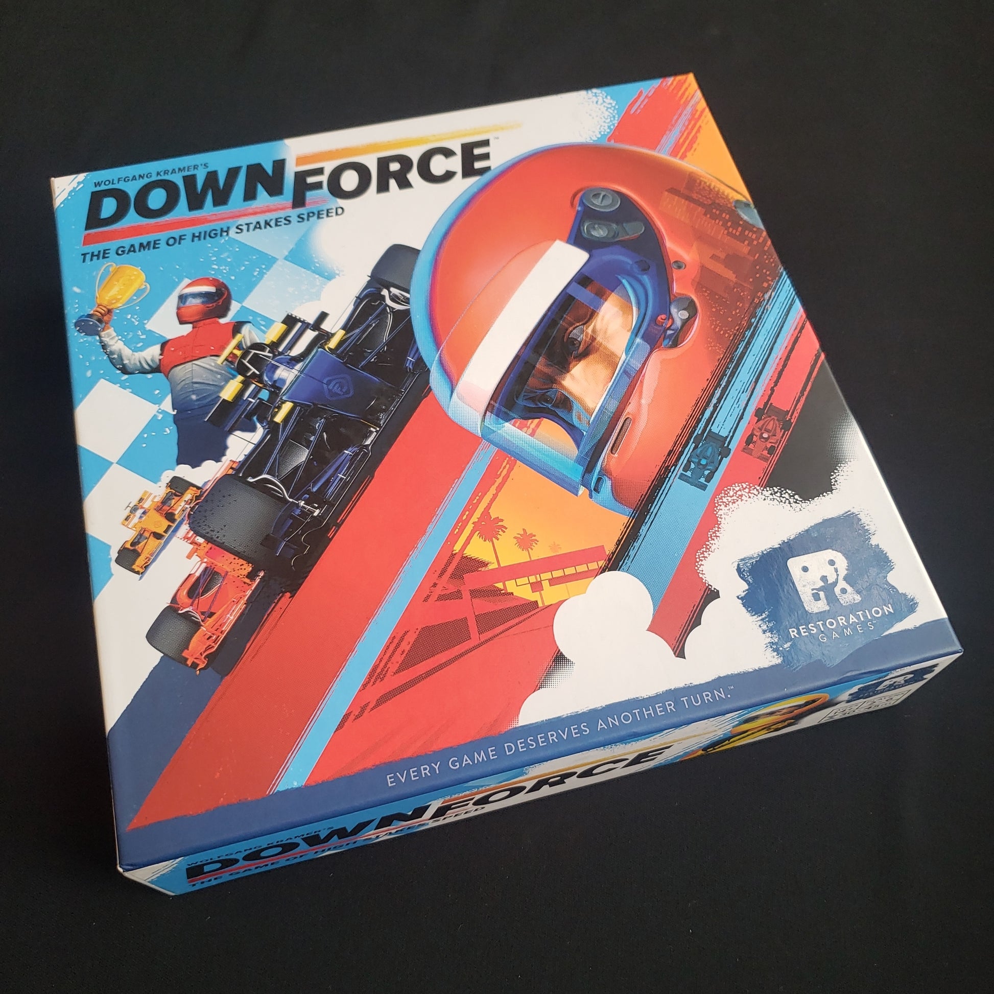 Image shows the front cover of the box of the Downforce board game