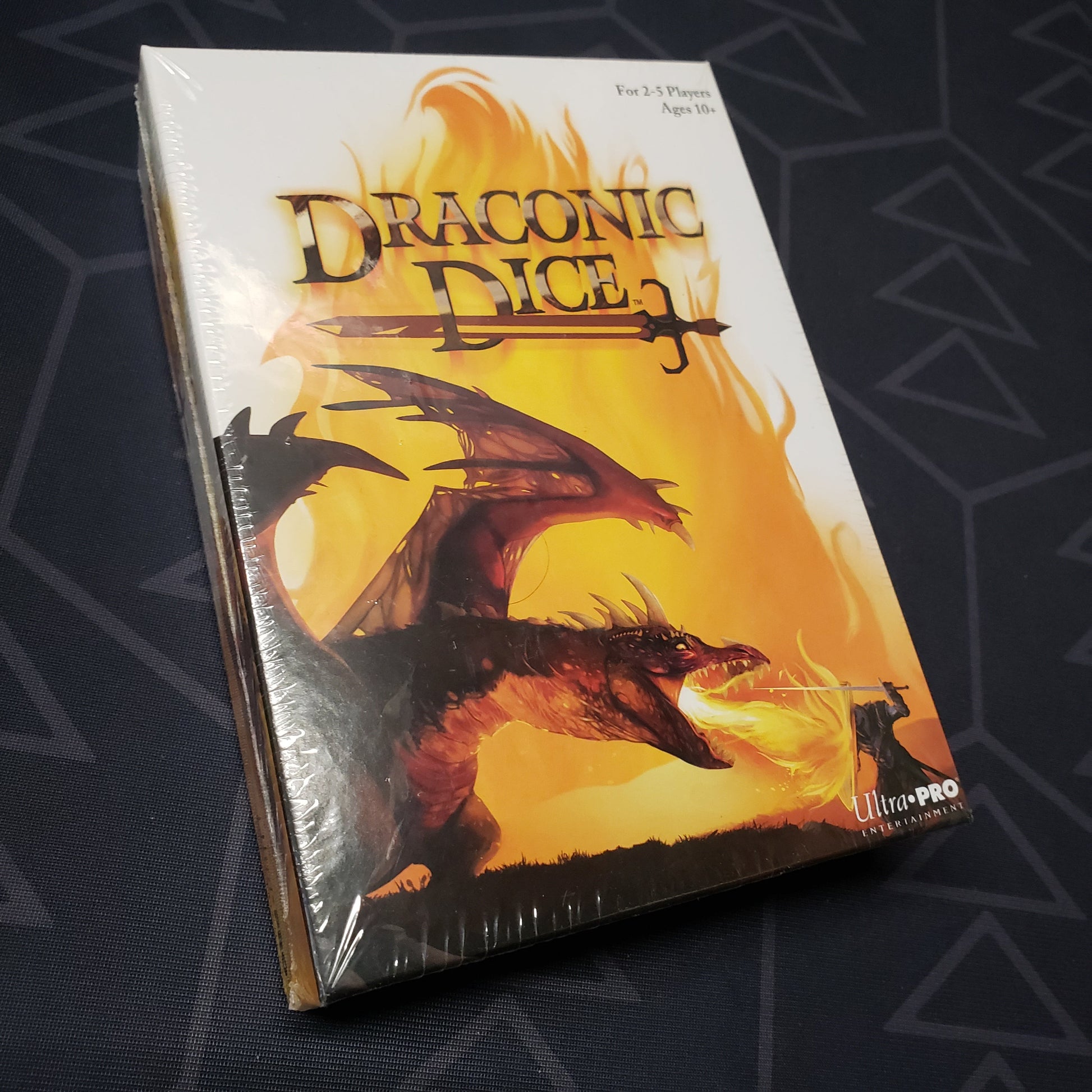 Image shows the front cover of the box for the Draconic Dice board game