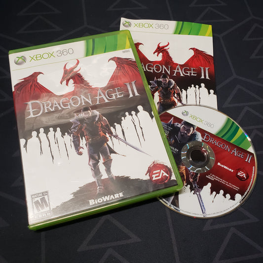 Image shows the case, manual and disc for the video game Dragon Age II for Xbox 360