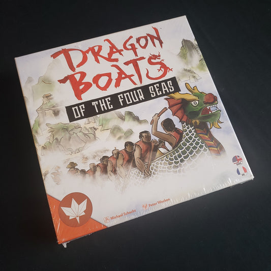 Image shows the front cover of the box of the Dragon Boats of the Four Seas board game
