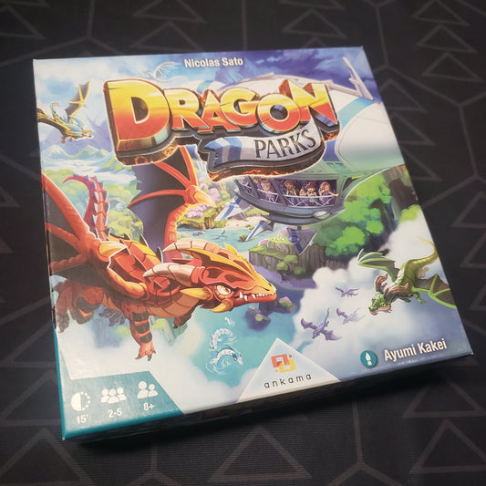 Image shows the front cover of the box for the Dragon Parks board game