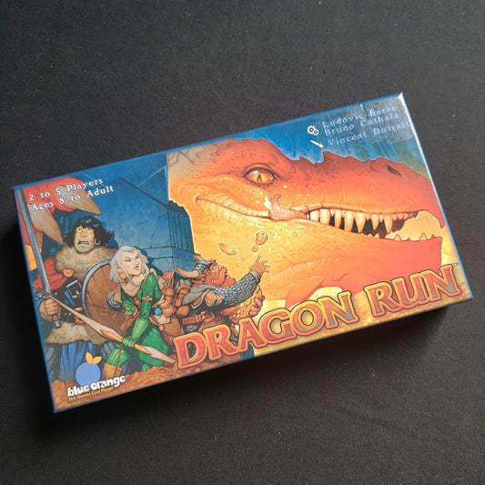 Image shows the front cover of the box of the Dragon Run board game