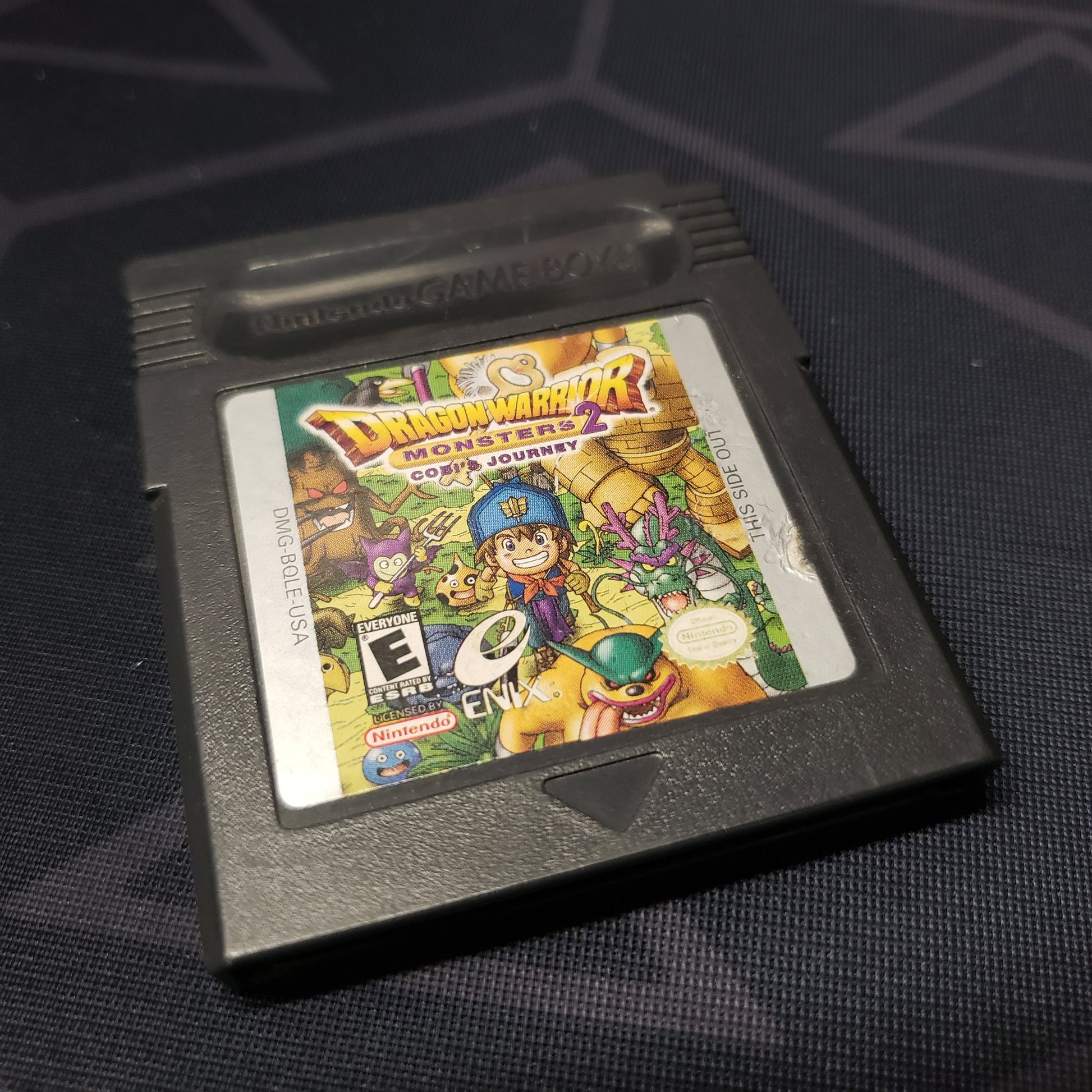 Image shows the front of the cartridge for the video game Dragon Warrior Monsters 2: Cobi's Journey for Nintendo Game Boy Color