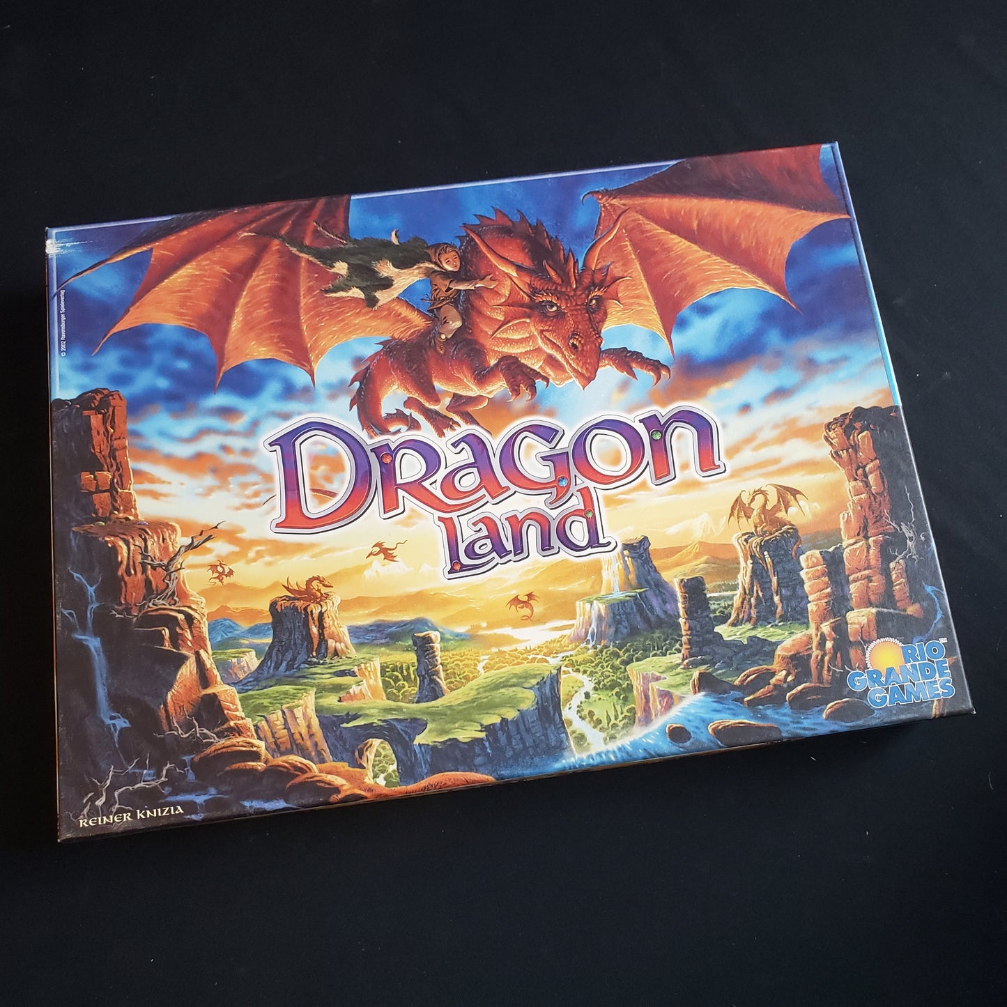 Image shows the front cover of the box of the Dragonland board game