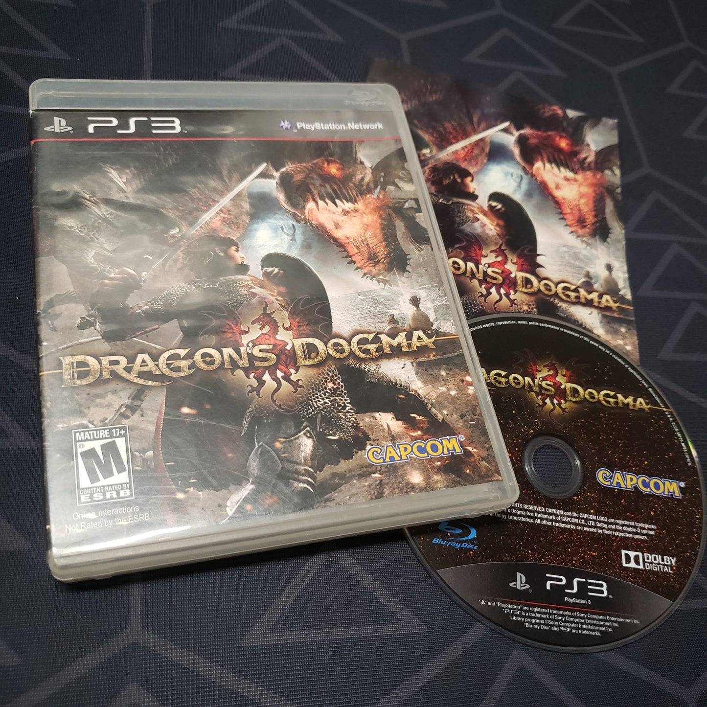 Image shows the case, manual and disc for the video game Dragon's Dogma for Playstation 3