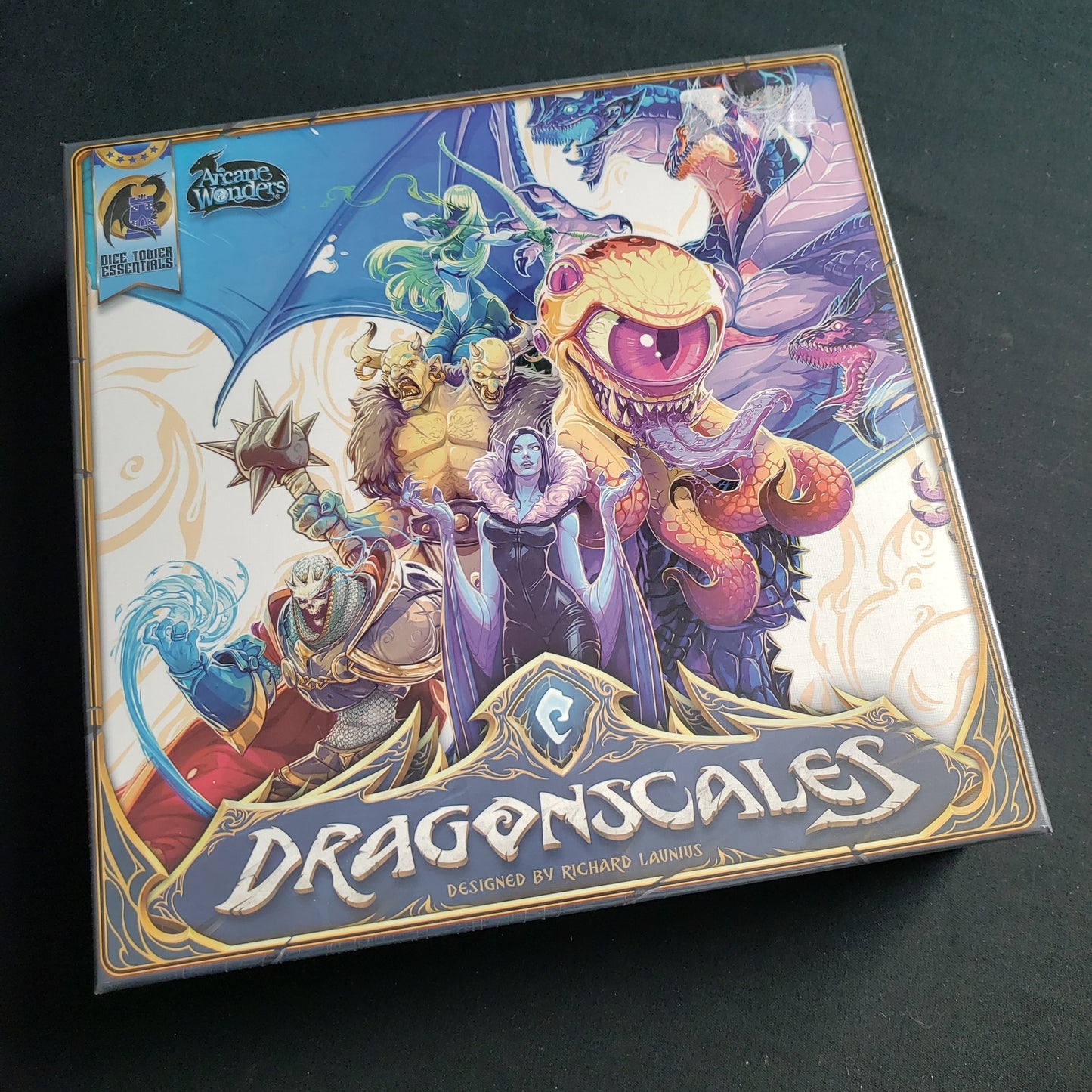 Image shows the front cover of the box of the Dragonscales board game