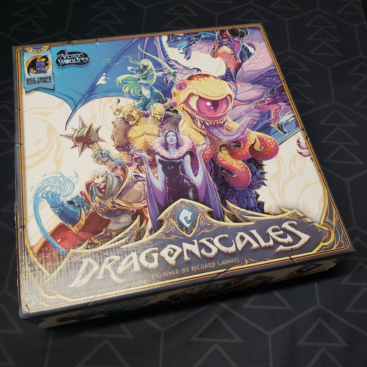 Image shows the front cover of the box of the Dragonscales board game