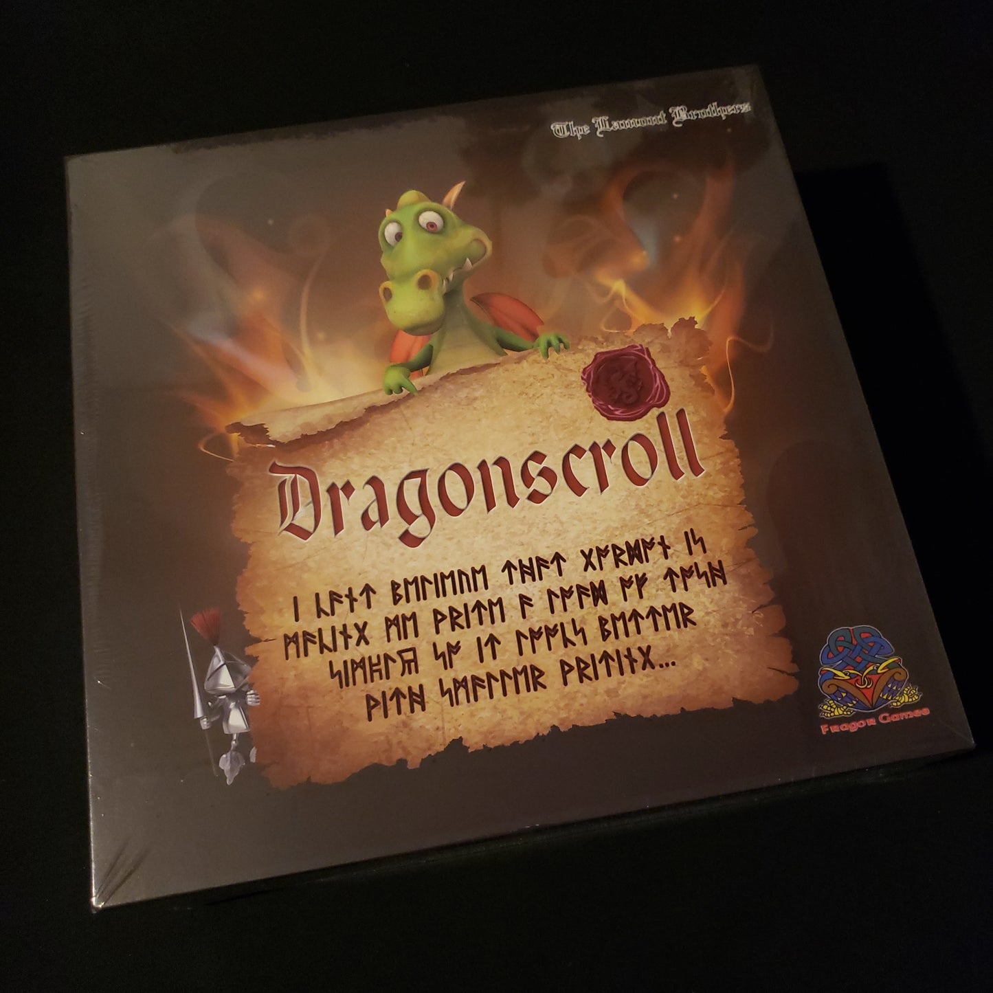 Image shows the front cover of the box of the Dragonscroll board game