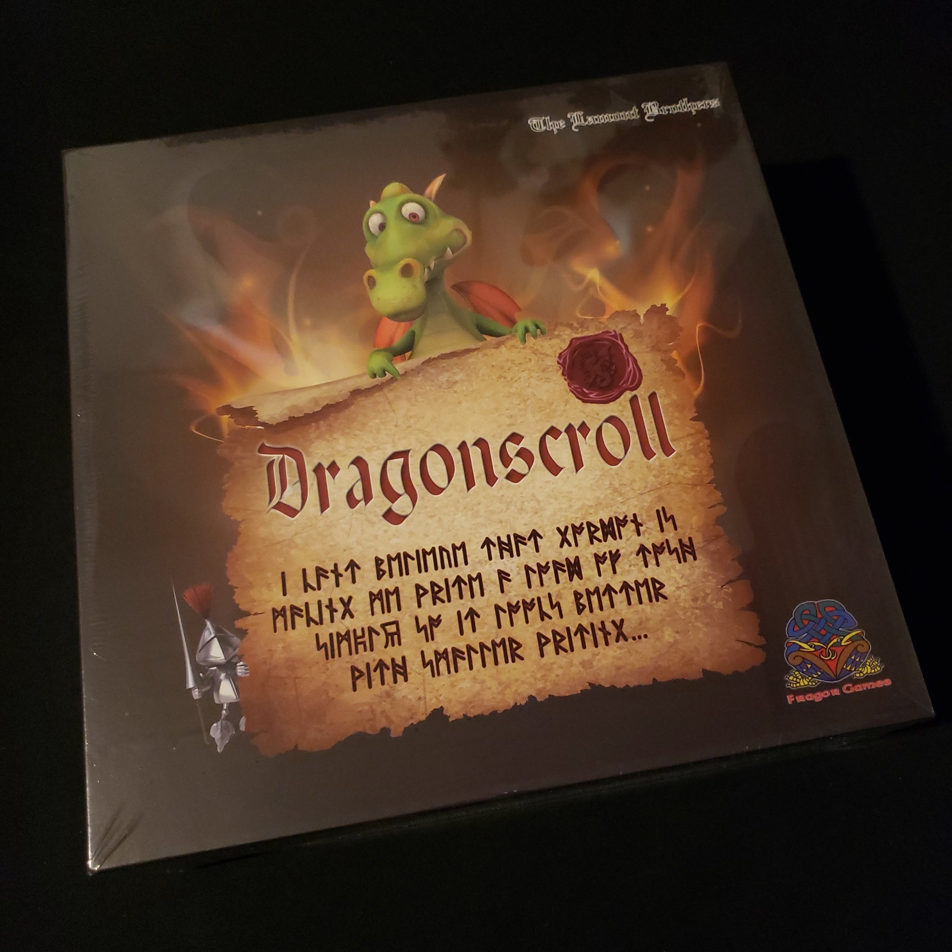 Image shows the front cover of the box of the Dragonscroll board game