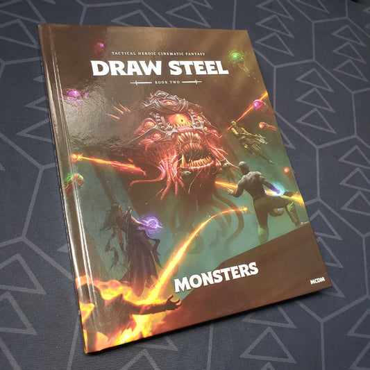 Image shows the front cover of the Book Two: Monsters book for the roleplaying game Draw Steel