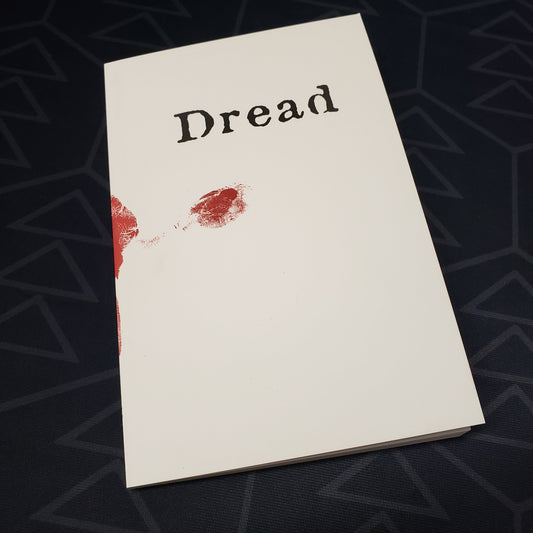 Image shows the front cover of the Dread roleplaying game book