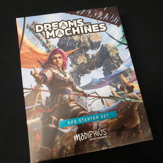 Image shows the front cover of the box of the starter set for the Dreams & Machines roleplaying game