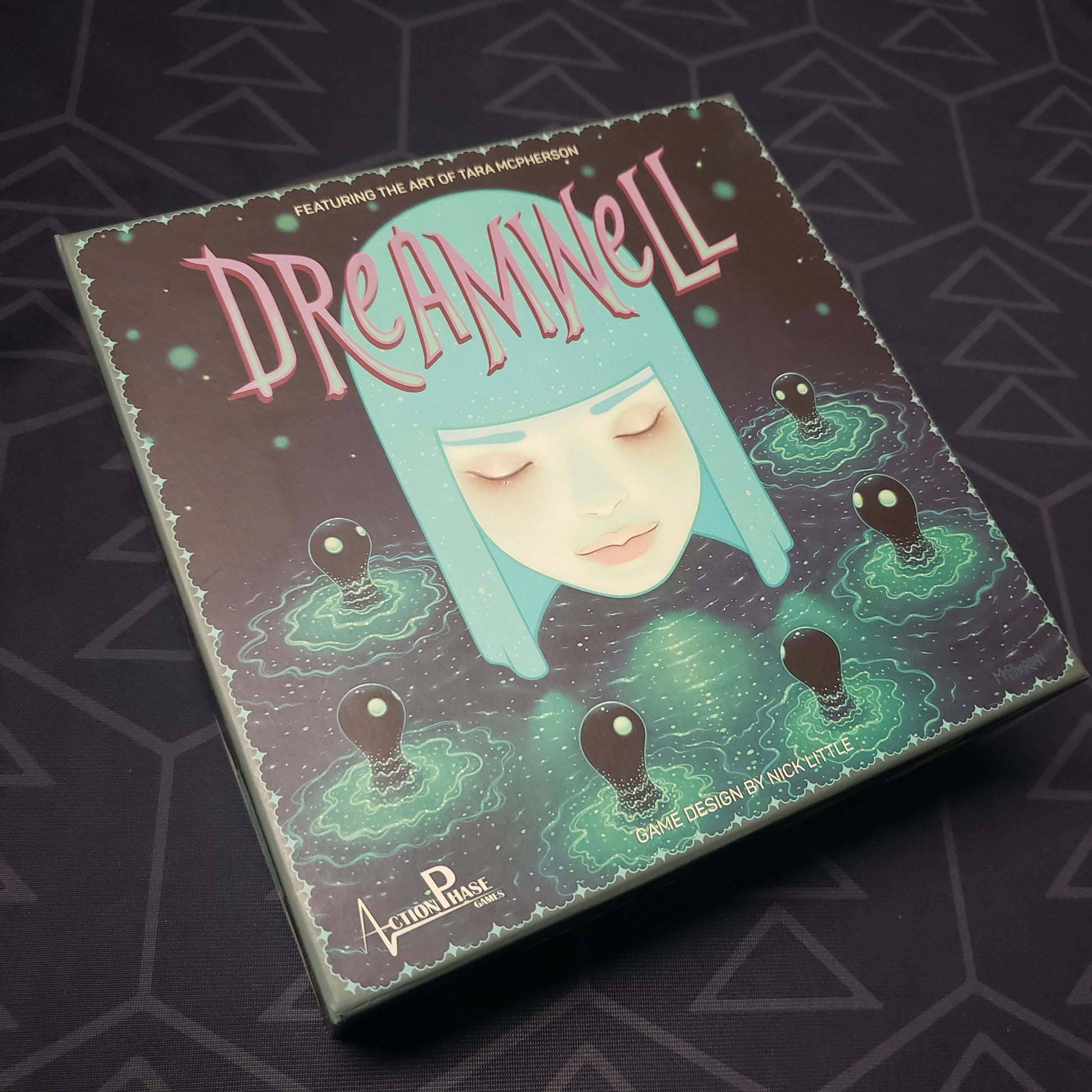 Image shows the front cover of the box for the Dreamwell board game