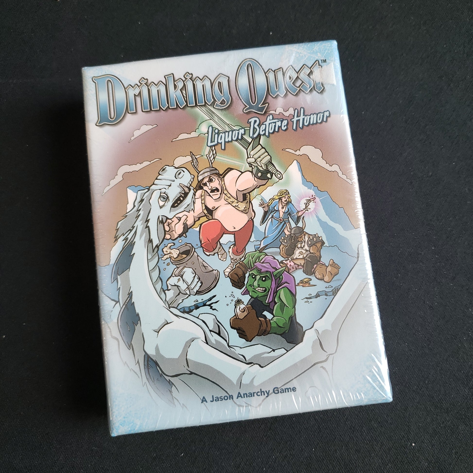 Image shows the front cover of the box of the Drinking Quest: Liquor Before Honor card game