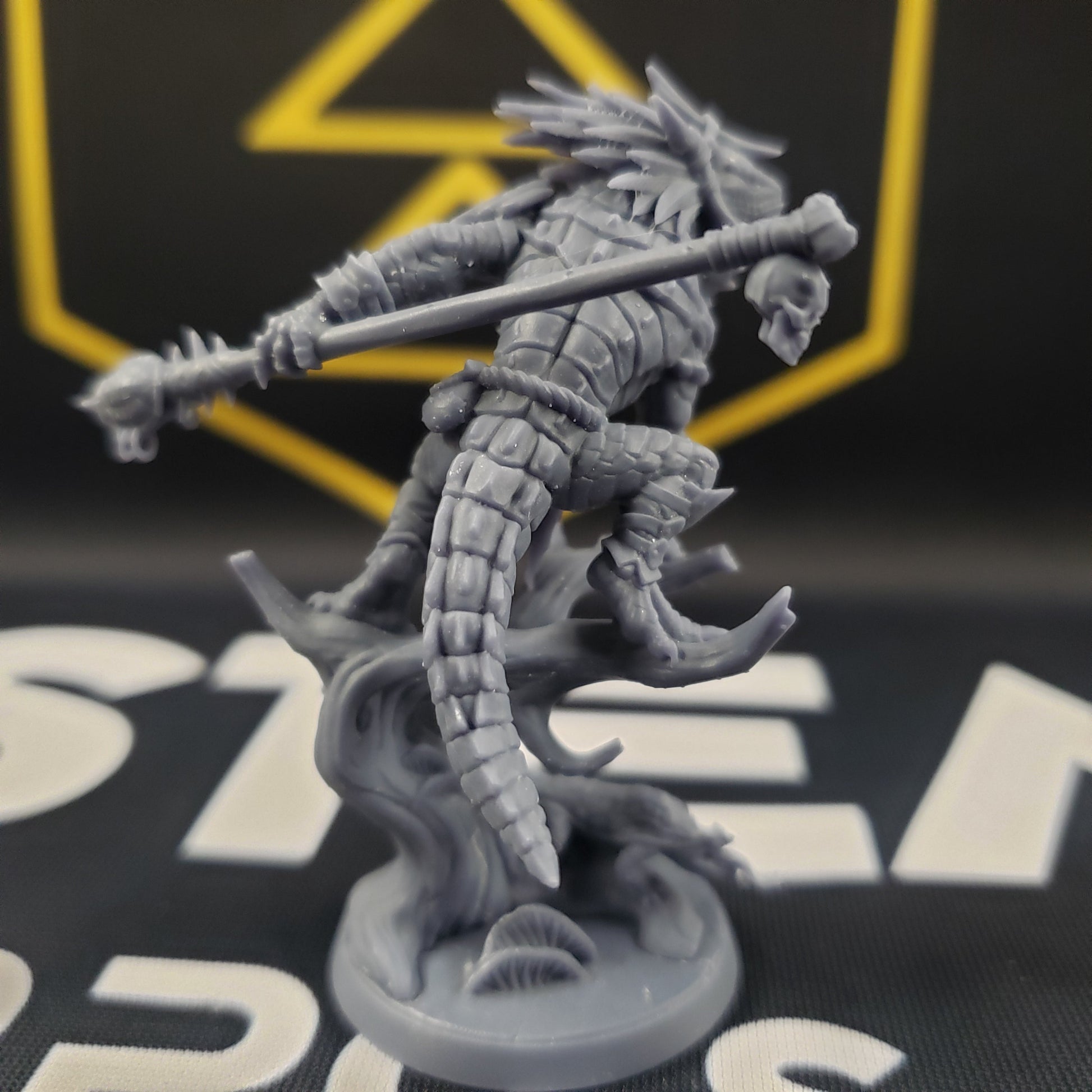 Image shows a lizardfolk druid gaming miniature.