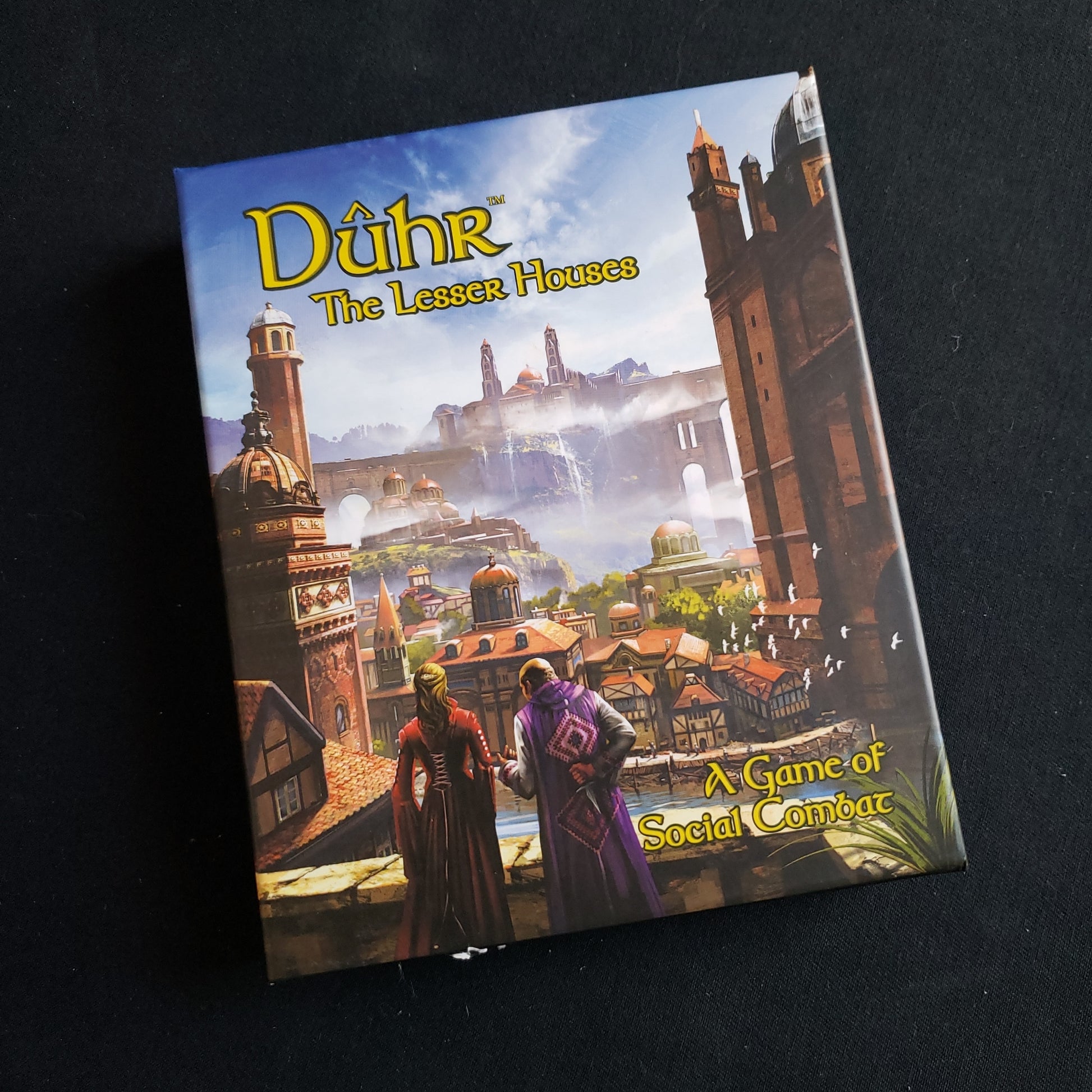 Image shows the front cover of the box of the Duhr: The Lesser Houses card game