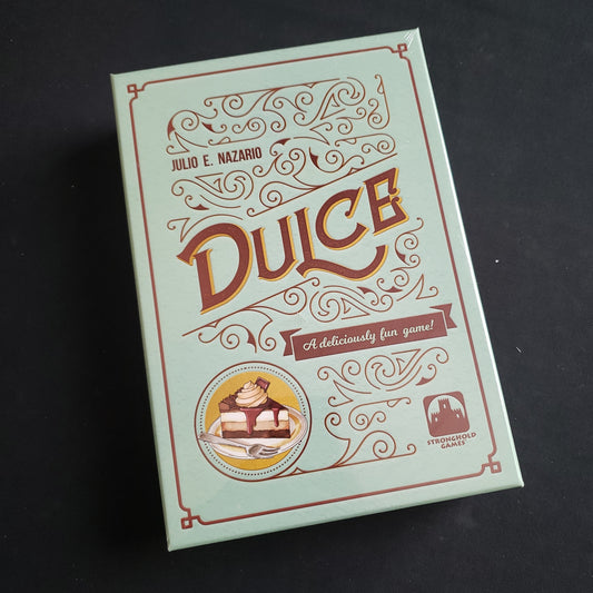 Image shows the front cover of the box of the Dulce board game