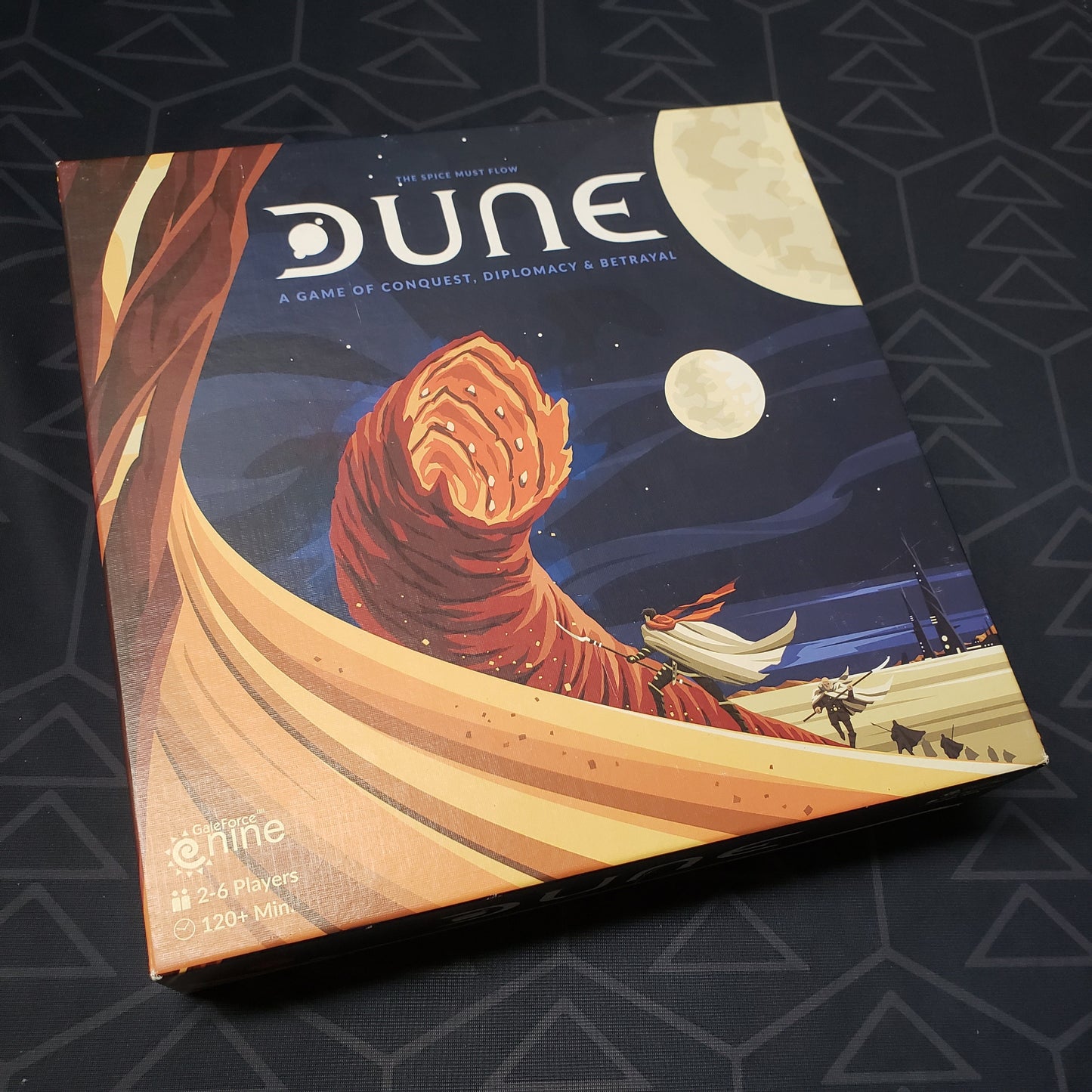 Image shows the front cover of the box for the Dune board game