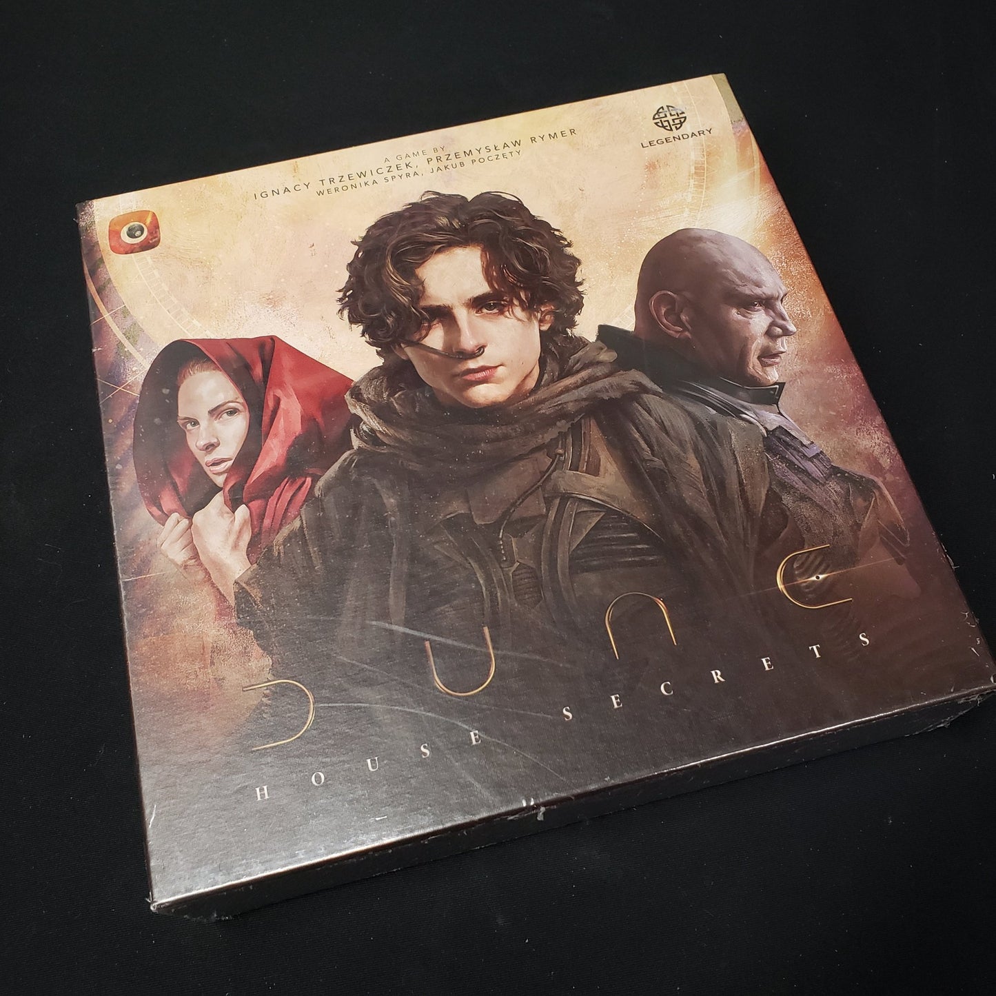 Image shows the front cover of the box of the Dune: House Secrets board game