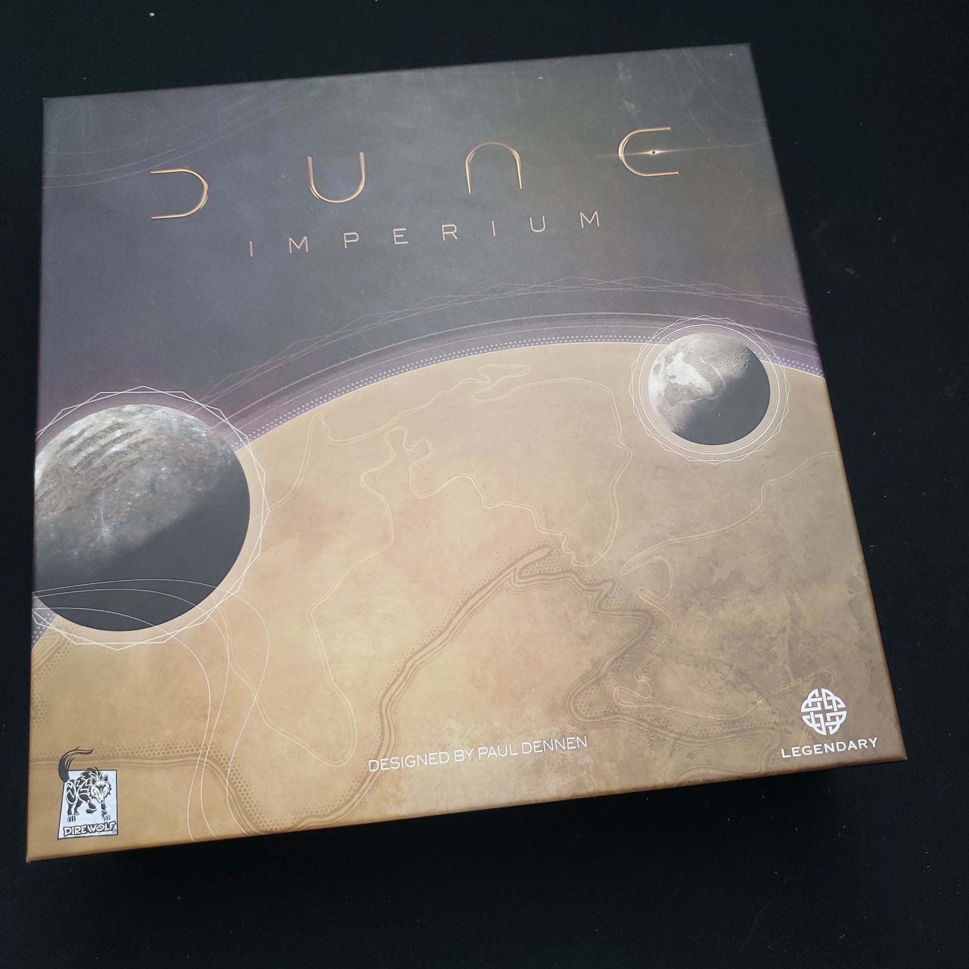 Image shows the front cover of the box of the Dune: imperium board game