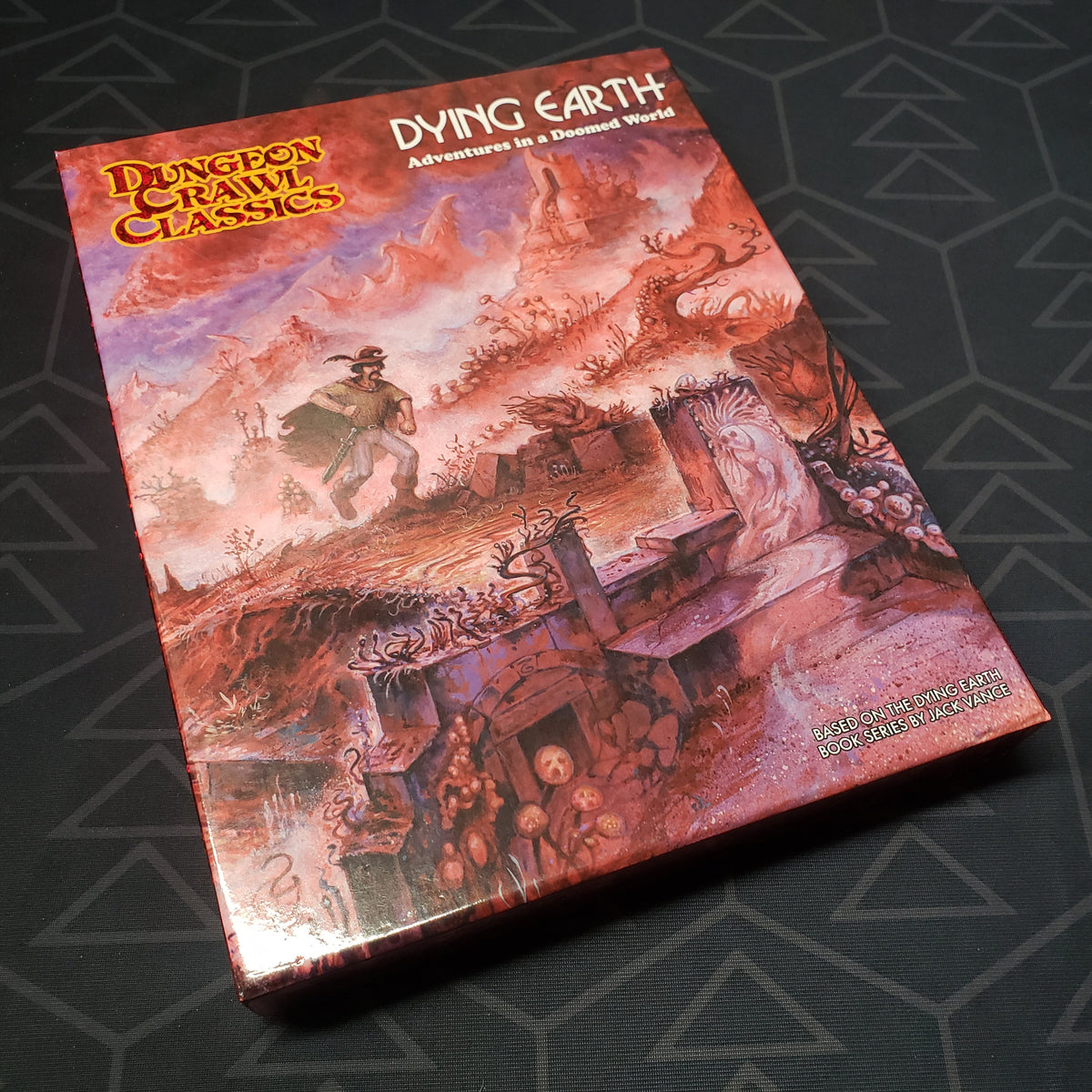 Image shows the front cover of the box of the Dying Earth set for the roleplaying game Dungeon Crawl Classics