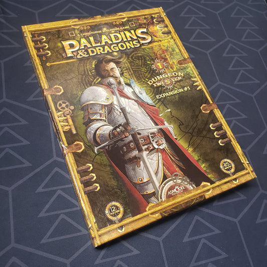 Image shows the front cover of the box of the Paladins & Dragons expansion for the board game Dungeon Twister