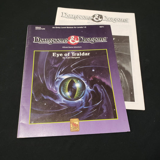 Image shows the booklet & front cover of the folio for the Eye of Traldar adventure book for the roleplaying game Dungeons & Dragons: First Edition