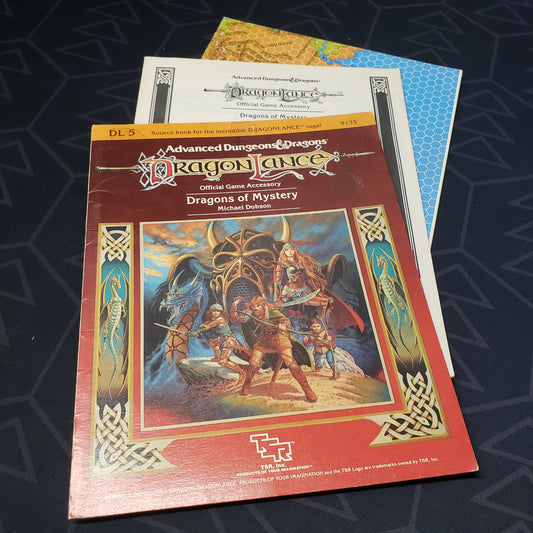 Image shows the front cover of the folio for the Dragonlance: Dragons of Mystery adventure module for the roleplaying game Dungeons & Dragons: First Edition, with the booklet and map inserts fanned out