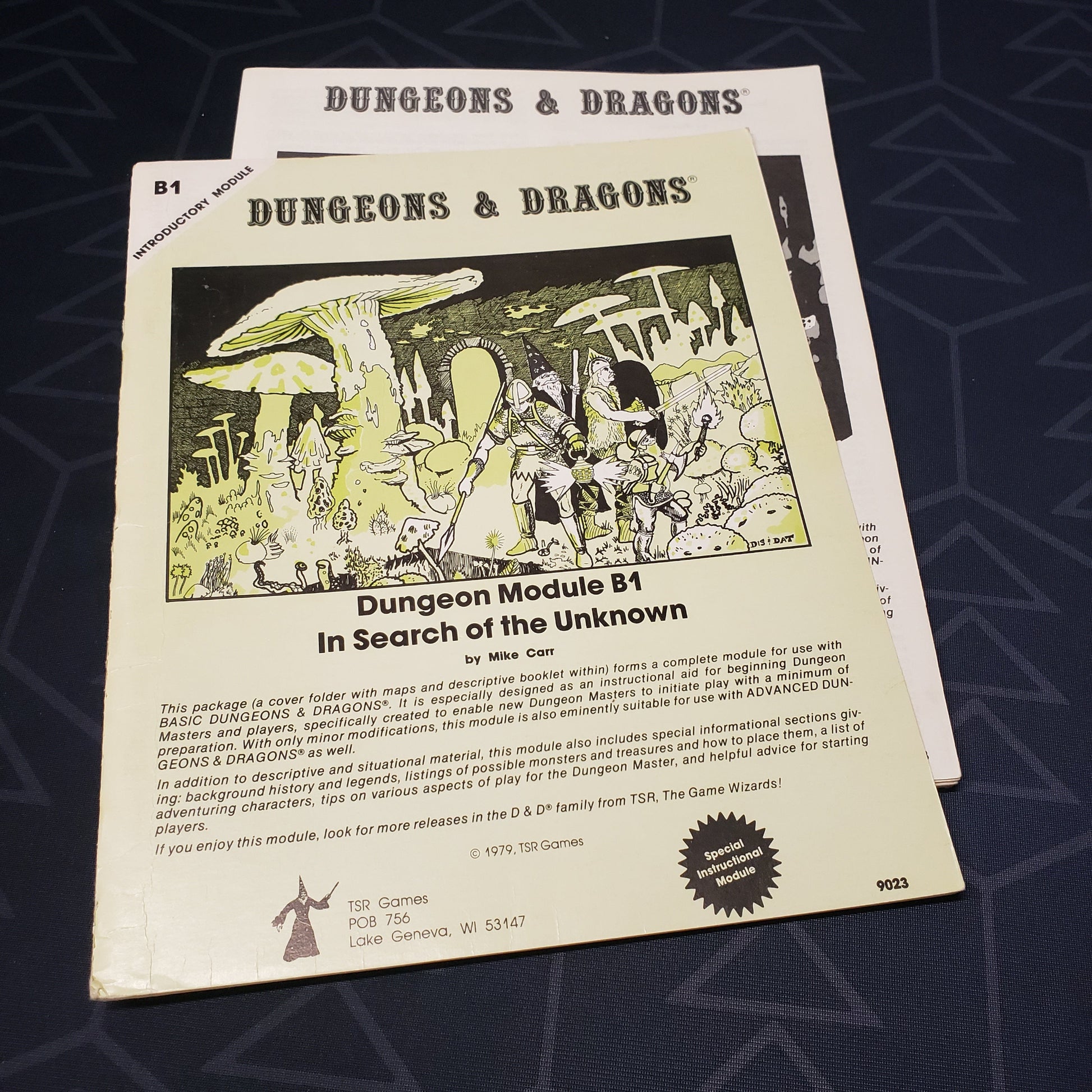 Image shows the front cover of the folio for the In Search of the Unknown adventure module for the roleplaying game Dungeons & Dragons: First Edition, with the booklet fanned out