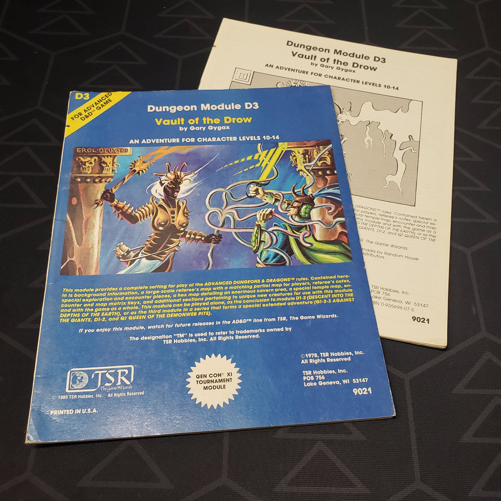 Image shows the front cover of the folio for the Vault of the Drow adventure module for the roleplaying game Dungeons & Dragons: First Edition, with the booklet fanned out