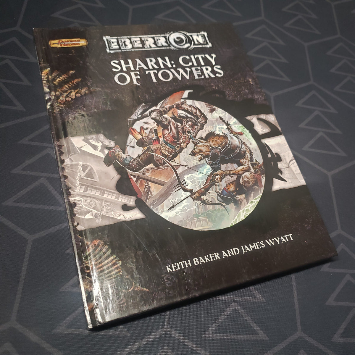 Image shows the front cover of the Eberron: Sharn, City of Towers book for the roleplaying game Dungeons & Dragons 3.5E