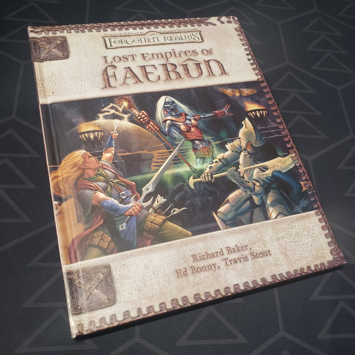 Image shows the front cover of the Forgotten Realms: Lost Empires of Faerun book for the roleplaying game Dungeons & Dragons 3.5E
