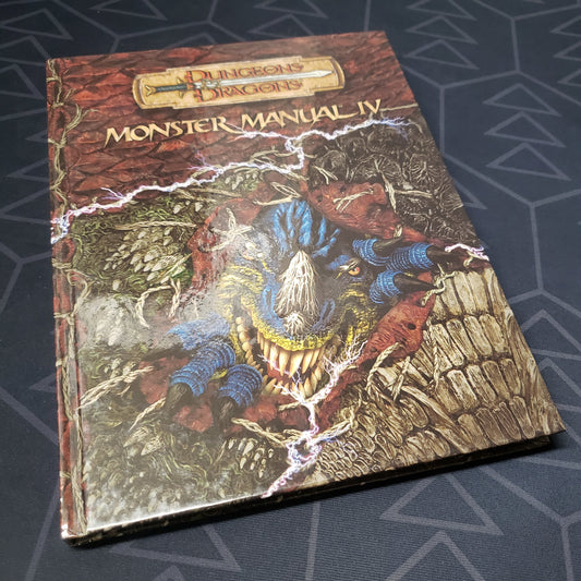 Image shows the front cover of the Monster Manual IV book for the roleplaying game Dungeons & Dragons: 3.5 Edition