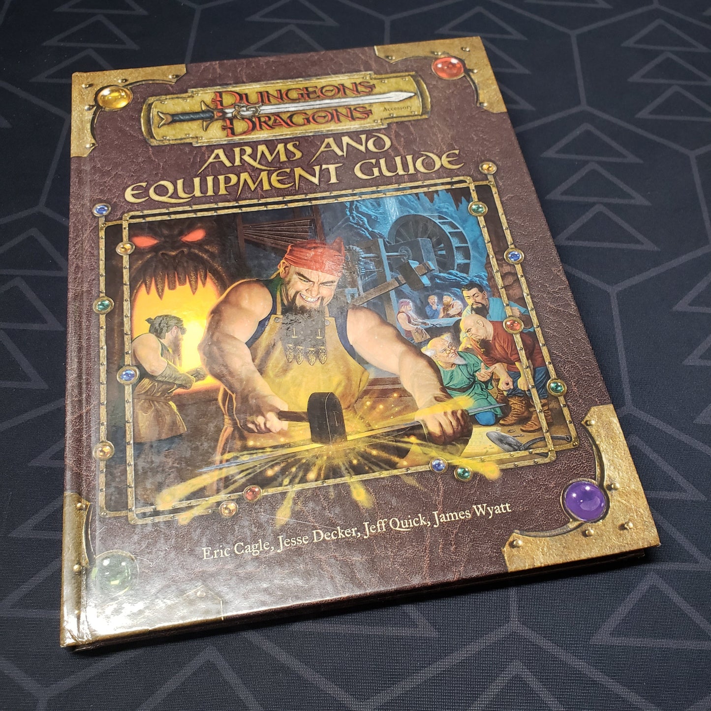 Image shows the front cover of the Arms and Equipment Guide book for the roleplaying game Dungeons & Dragons: Third Edition