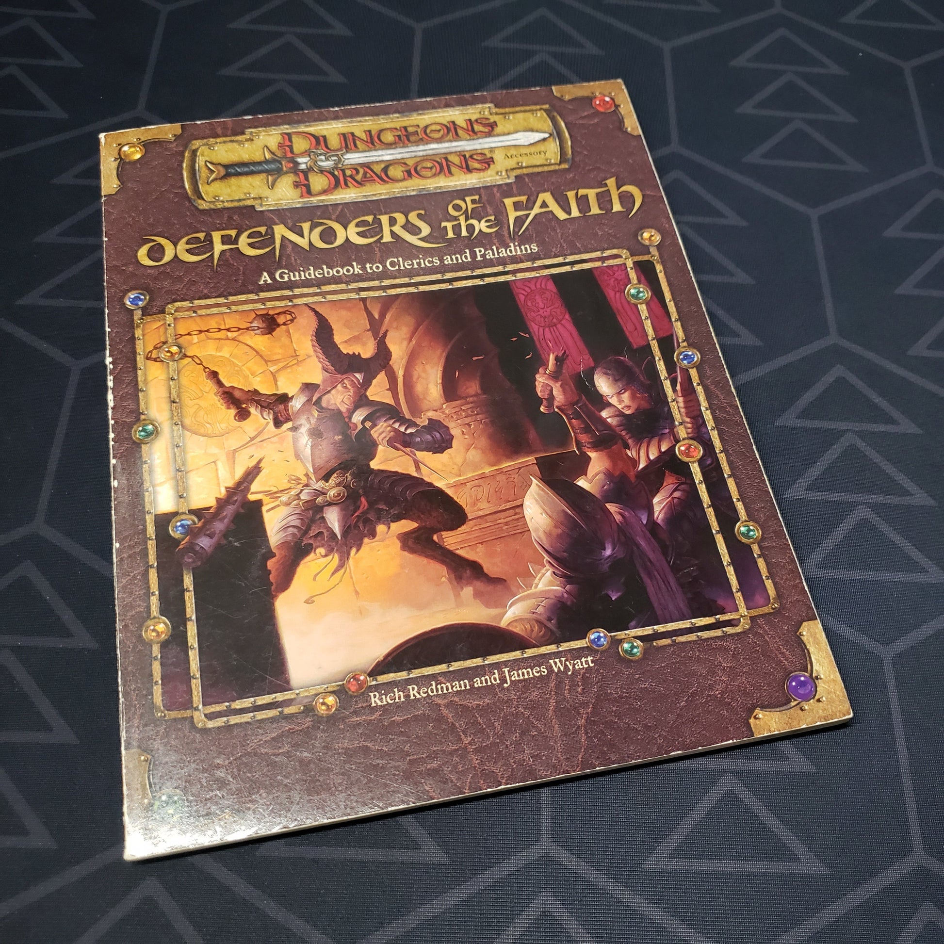 Image shows the front cover of the Defenders of the Faith book for the roleplaying game Dungeons & Dragons: Third Edition